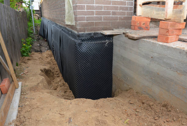 Happy homeowners after waterproofing job in Owenton